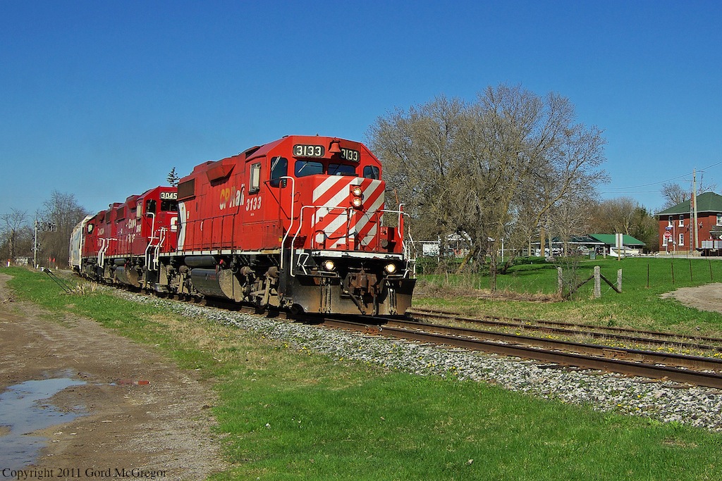 T08 passes the one time location of Myrtle Station built in 1884 and demolished in 1974 it sat beside the large tree beside the locomotive.Still a quaint railroad town Myrtle still sees 4 trains a week.