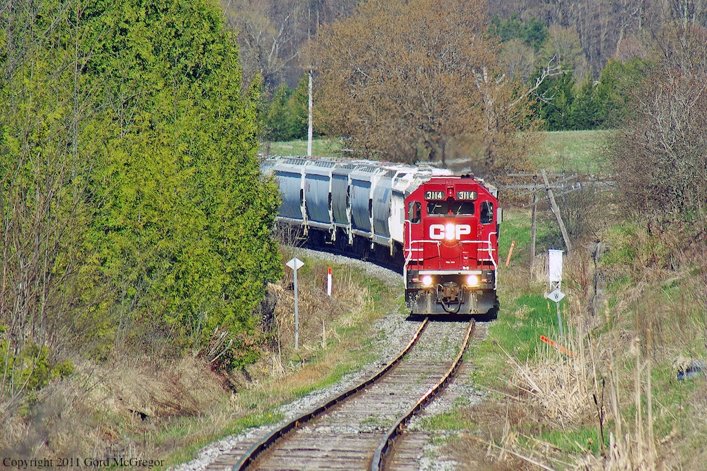 Heading into the S curve 3114 passes the historic junction of the on time Whitby Port Perry Railway built in 1871 the stone abutment can be seen to the right of the train.