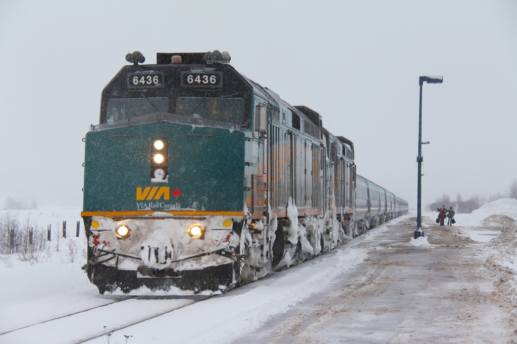 A late running #14 pauses to drop off a couple of passengers before heading east to Halifax.