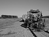 My Cando junior tamper rest on the CP Rocanville sub after doing a tie change out while IC 1001 sits behind waiting for a crew. 