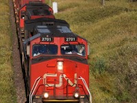 CN Q116 with IC 2701 slowly move this 145 car intermodal up hill with a bad wheel that was reported ready to come off.