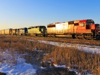 SOO 6057 leads a quartet of EMD power through the South Switch at Smithville just as the sun begins to rise.