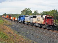 Leaning into the curve at the east end of the siding, SOO 6035, CITX 3110, and CEFX 3168 make time with train 142, 80 miles from the crew change at Smiths Falls. 1122hrs.