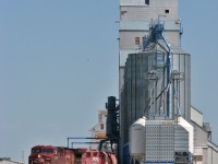 CP AC4400CW 9609 which is a big locomotive looks a like toy compared to the towering elevators the stand in Redvers.