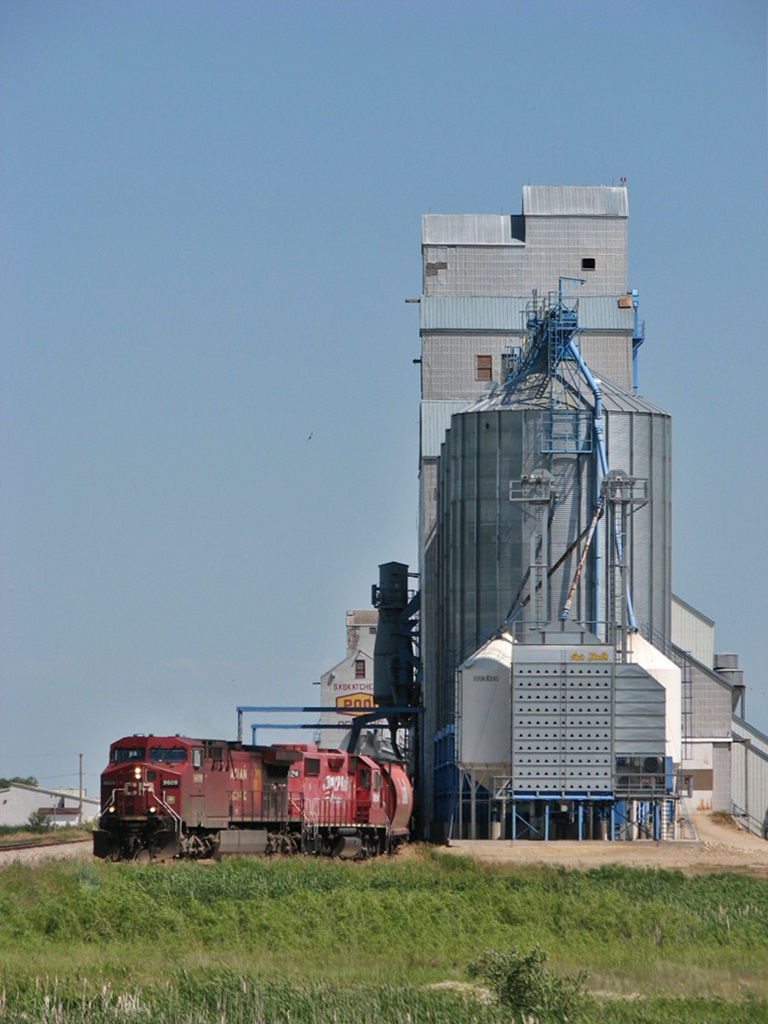 CP AC4400CW 9609 which is a big locomotive looks a like toy compared to the towering elevators the stand in Redvers.