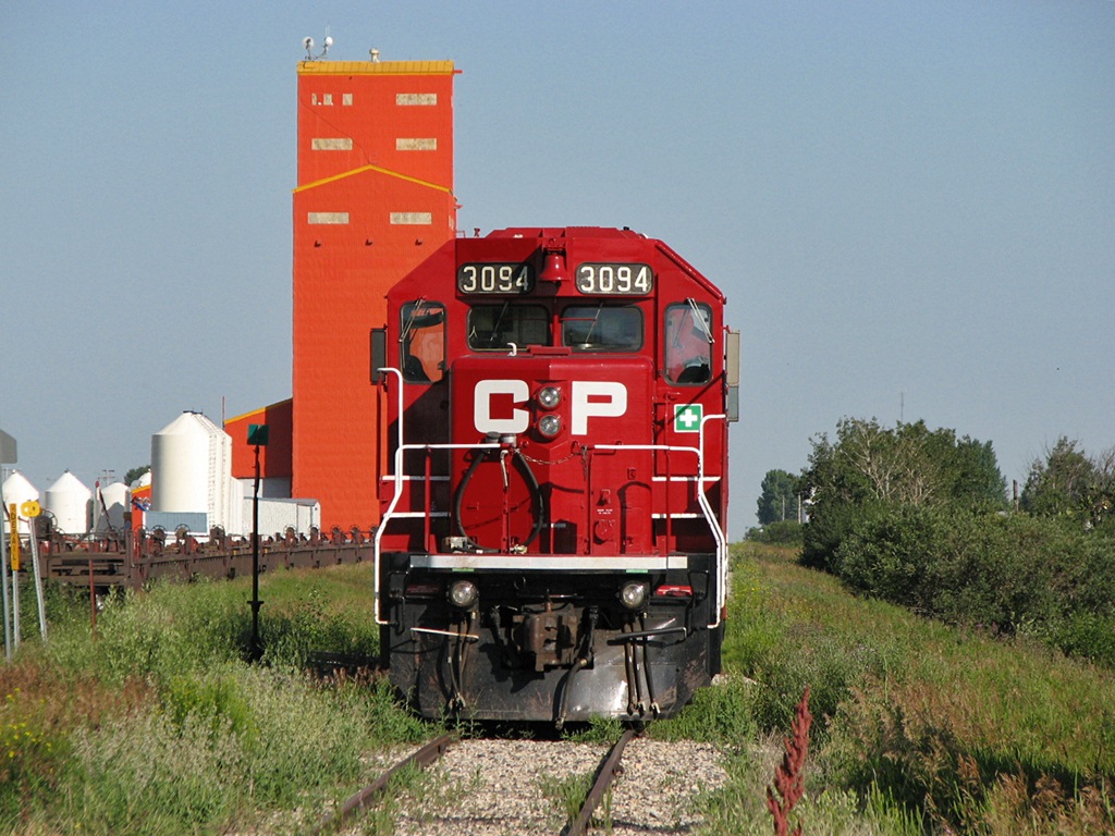 CP 3094 and 3105 brought in a string of stored intermodal well cars on the now Stewart Southern Railway who bought the line from CP.