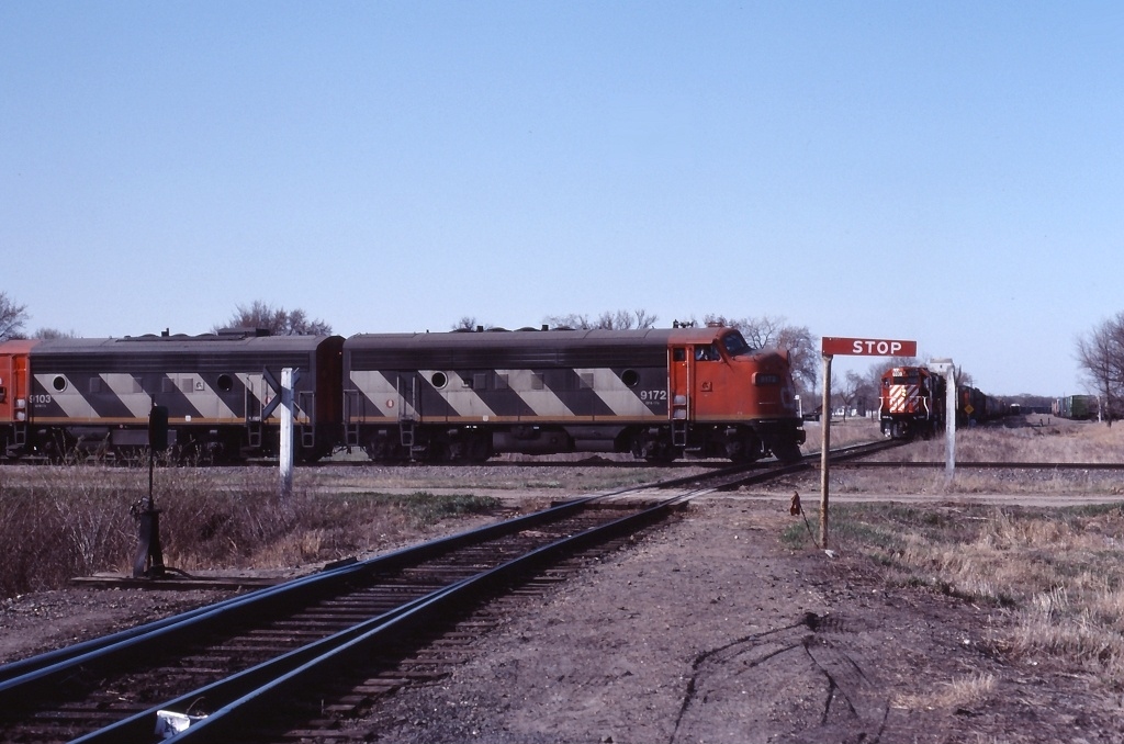 CN 532 crosses the CP diamond at Emerson, Manitoba as a CP awaits it\'s turn
