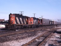 CN 557 rolls through Burlington West behind CN 4595 and CN 4104