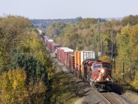 The sign of fall foliage can be seen as a pair of mac's break the silence of the country side, as 9151 leads CP 220