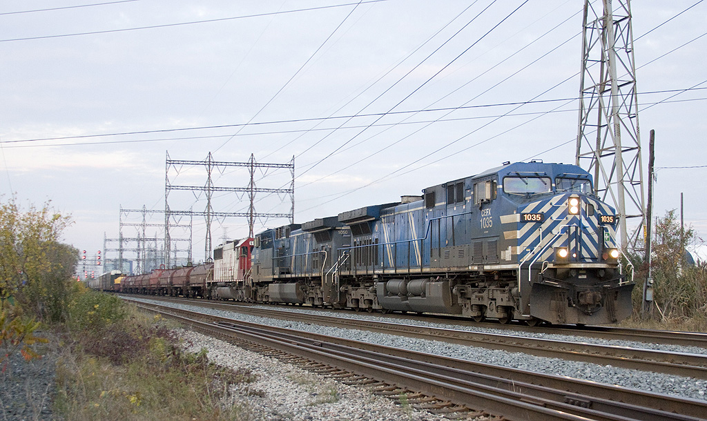 A trio of CEFX\'s lead today\'s CP 254, with a nice suprise and back on home rail\'s ex SOO ex  INRD rolls past me with the last bit of light on what was a beautiful fall day.