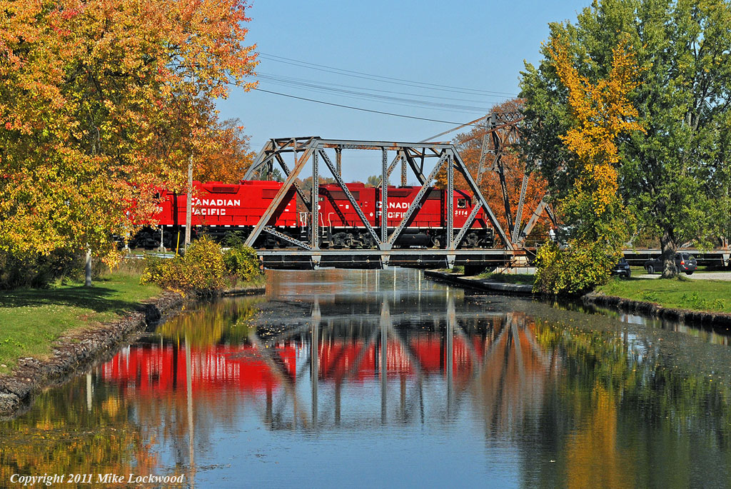 CP 3114, 3038, and 3043 cross the Trent Canal on their way to Havelock. 1325hrs.