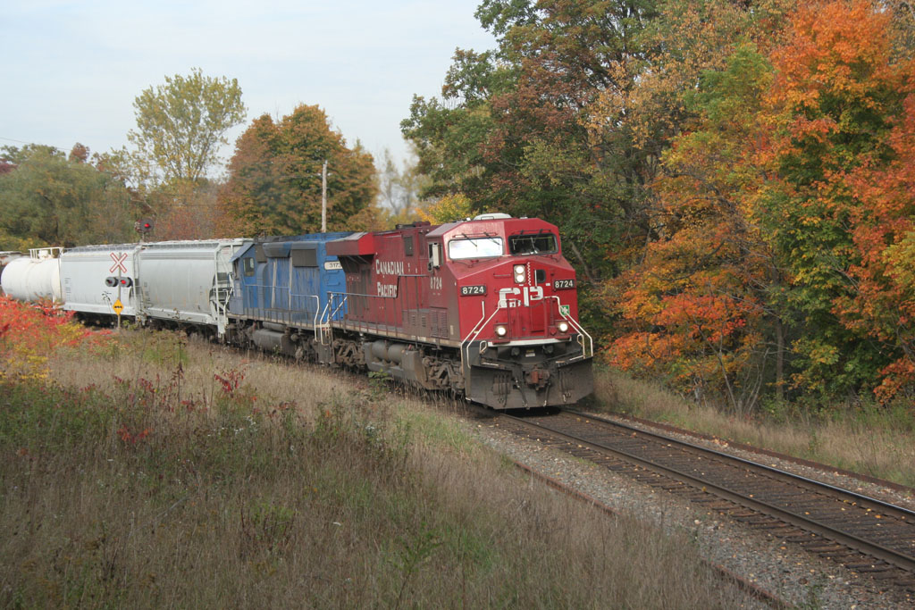 CP 245 blasts out of Cambridge at Orrs Lake hill backdropped by fall colours.