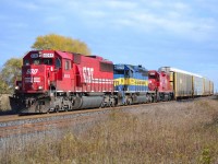 CP 235 led by SOO 6044, ICE 6414 & CP 3043 rounds the bend and heads westbound thru Lovekin.