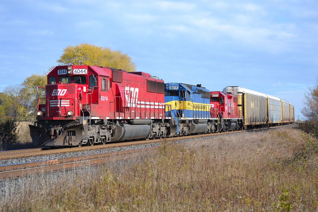 CP 235 led by SOO 6044, ICE 6414 & CP 3403 rounds the bend and heads westbound thru Lovekin.