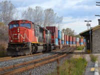 CN 121 led by 5691 & 5683 hauls this intermodal train westbound as it winds thru Port Hope and passes the VIA Station.