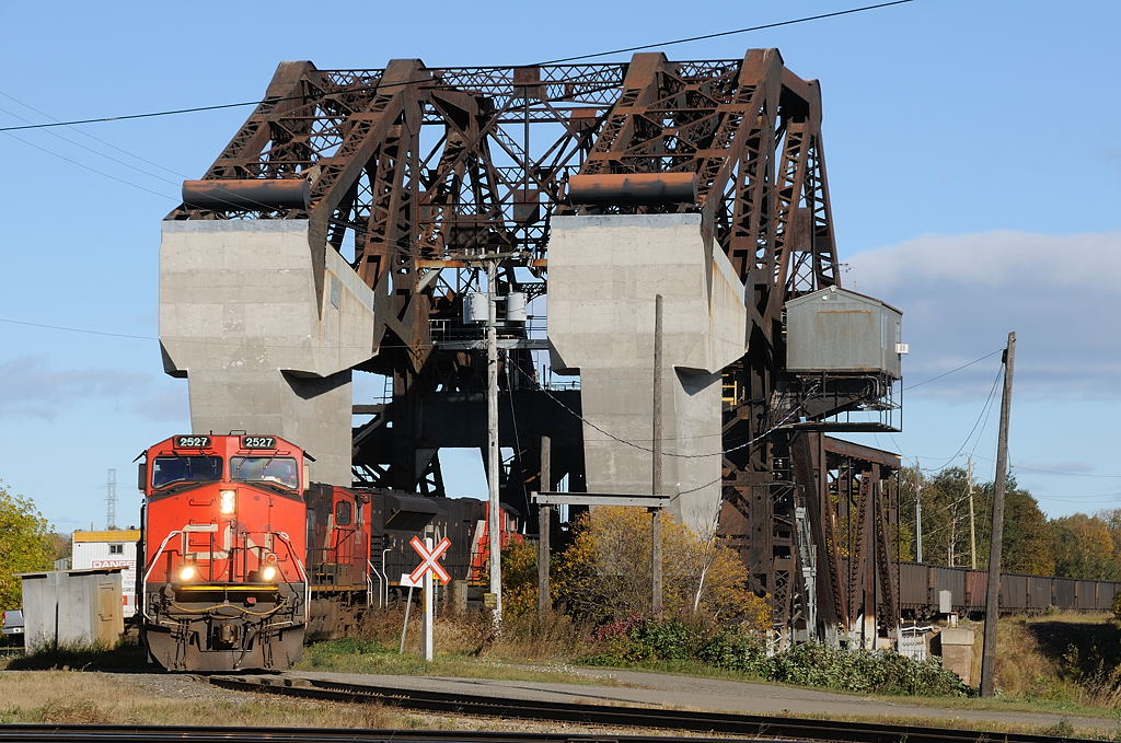 CN coal train, C773 crosses over the Jack Knife bridge as it departs the Island after Thunder Bay Terminals Ltd. dumped the 150 cars of coal. Today\'s power was CN 2527- CN 2582- CN 8953