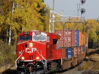 CP 113-06 crests the grade at Loon with brand new GEVO 8925 in the lead. Mid train CP 8926 does "helper" duty.