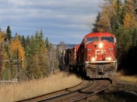 On the approach to Loon, CP SD90Mac 9147 + SD40-2B 6076 + SD40-2F 9014 grind Toronto to Thunder Bay freight 221-24 through one of the many S- curves on the Nipigon Subdivision. With most deciduous trees having lost their leaves, the Tamarac's, only coniferous trees to change colour in the fall brighten up the scene.