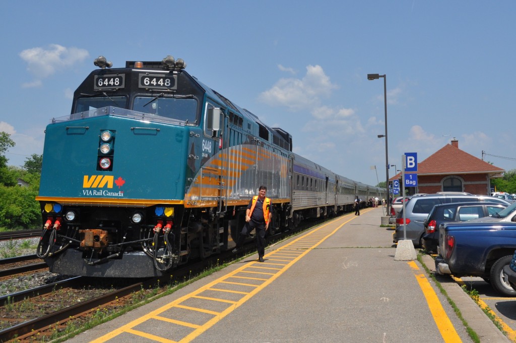 Passenger business is brisk at Cobourg as the Headend Trainman poses with the newly re-built (spring 2011) Via#6448 in charge of  train #57 awaiting the scheduled 14:50 departure