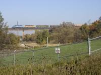 Fall foliage colours in the GTA and surrounding the area come alive, as GEXR 431 finally heads west after being tied down for the night in mac yard.