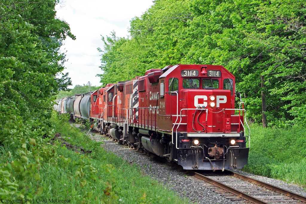 With a surprise replacement of 3045 this week is 3013 a GP38AC is in second position along with 3133.The crew is playing it safe with an extra cable on the nose .