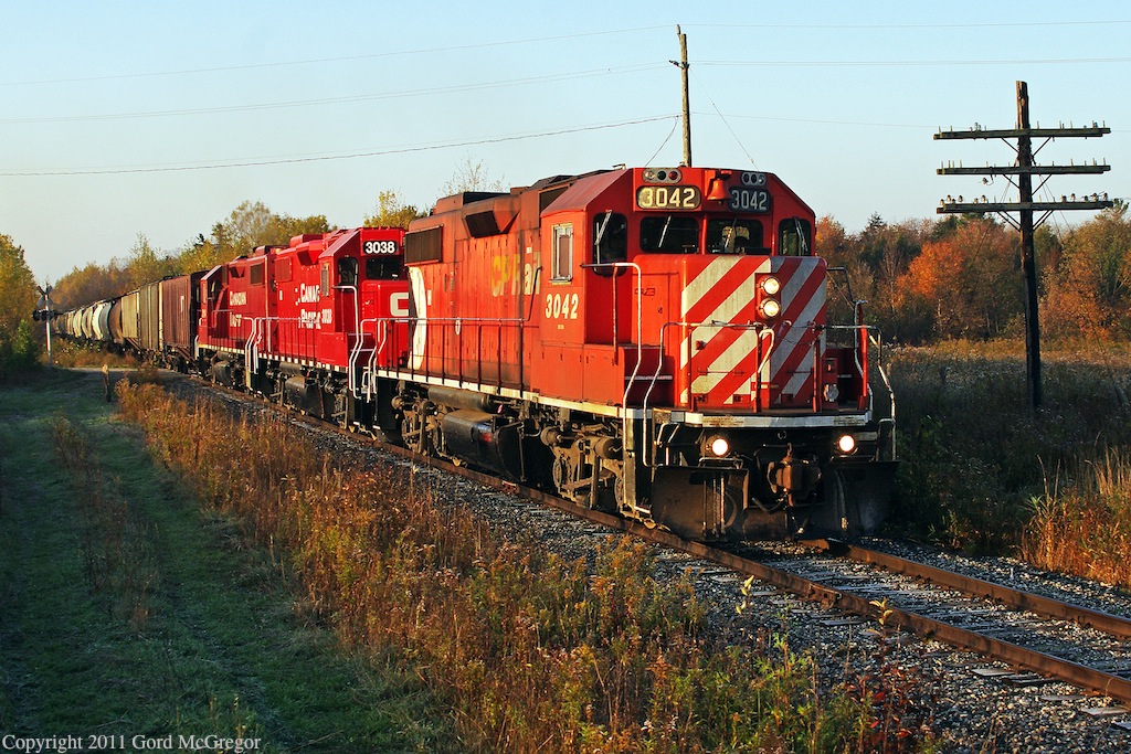 3042 leads with 3038 and 3114 on wonderful fall morning at the one time settlement of Atha Road currently consisting of 4 occupied homes and a early century schoolhouse.With 18600 acres of empty Federal land one can here the train in Locust Hill.