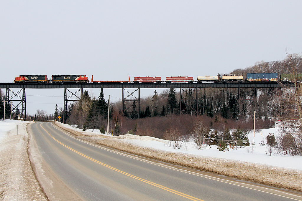 CN L57231 06 - CN 6012S (The Algoma Central SB manifest from Hearst to Sault Ste Marie) heads across the Bellevue Trestle a few miles north of the Lock City.