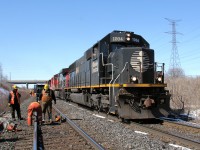 CN's M39671 25 one of two of the Daily Memphis Harrison, TN originated trains bound for Canada is on the final approach to Toronto's MacMillan classifcation yard. The other train will wind up in Winnipeg, Canada. Meanwhile work is under way to fix faulty rails.