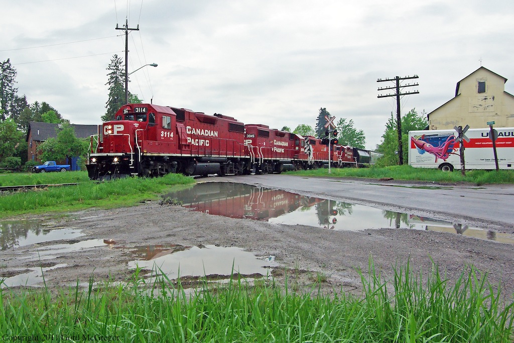3114 is seen reflecting in the puddles in Claremont in what was a very rainy May.Along with the usual power 3133,3045 8200 is on its way to Peterborough to serve as a switcher.
