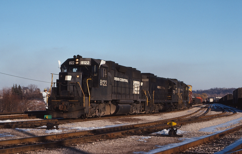 The Starlight with Penn Central power, shuffles it\'s CP caboose around