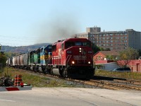 242 crossing Main Street behind SOO 6062 - DME 6364 - HLCX 6299