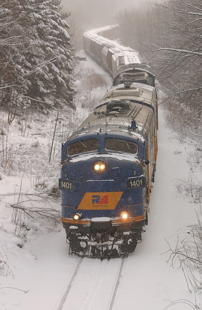The classic lines of an F Unit emerge from the squalls, as the Goderich job snakes through the outskirts of Stratford