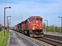 CN 5634 pulls a mixed freight through Kingston VIA Station