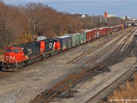 CN X371 rolls into Oshawa and prepares to enter the yard at Oshawa Center to perform a set-out and lift. Nice that the first SD40-2W I've shot in about a year was clean, and the paint not peeling (too much). CN 5611 and 5335. 1323hrs.