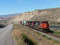 SD70M-2s 8813 and 8898 depart from Ashcroft as they lead an eastbound intermodal over the Thompson River.