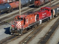 GP9u 1634 and MP15DC 1443 make their way through Port Coquitlam Yard.