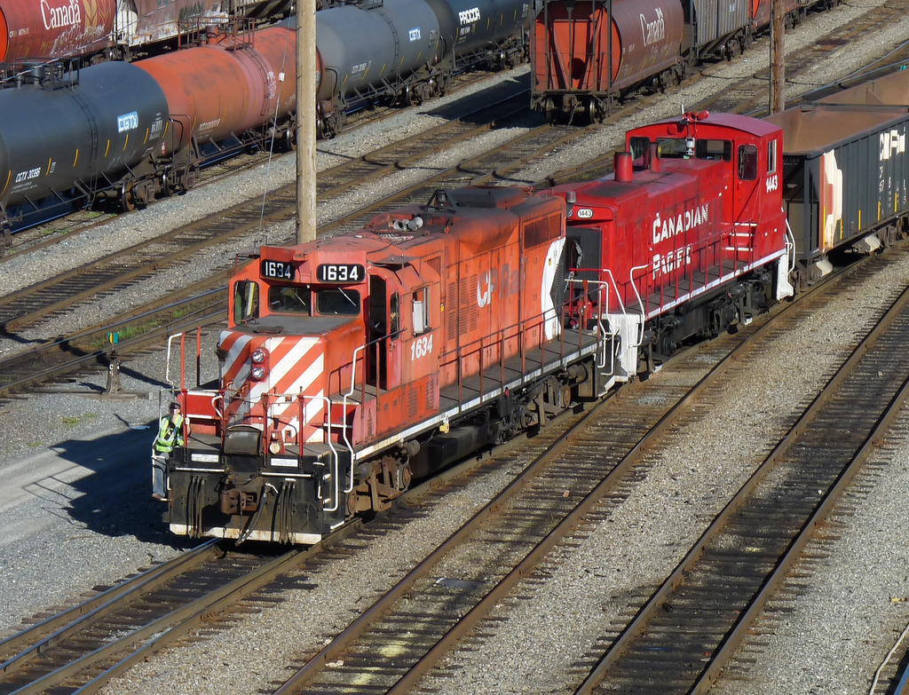 GP9u 1634 and MP15DC 1443 make their way through Port Coquitlam Yard.