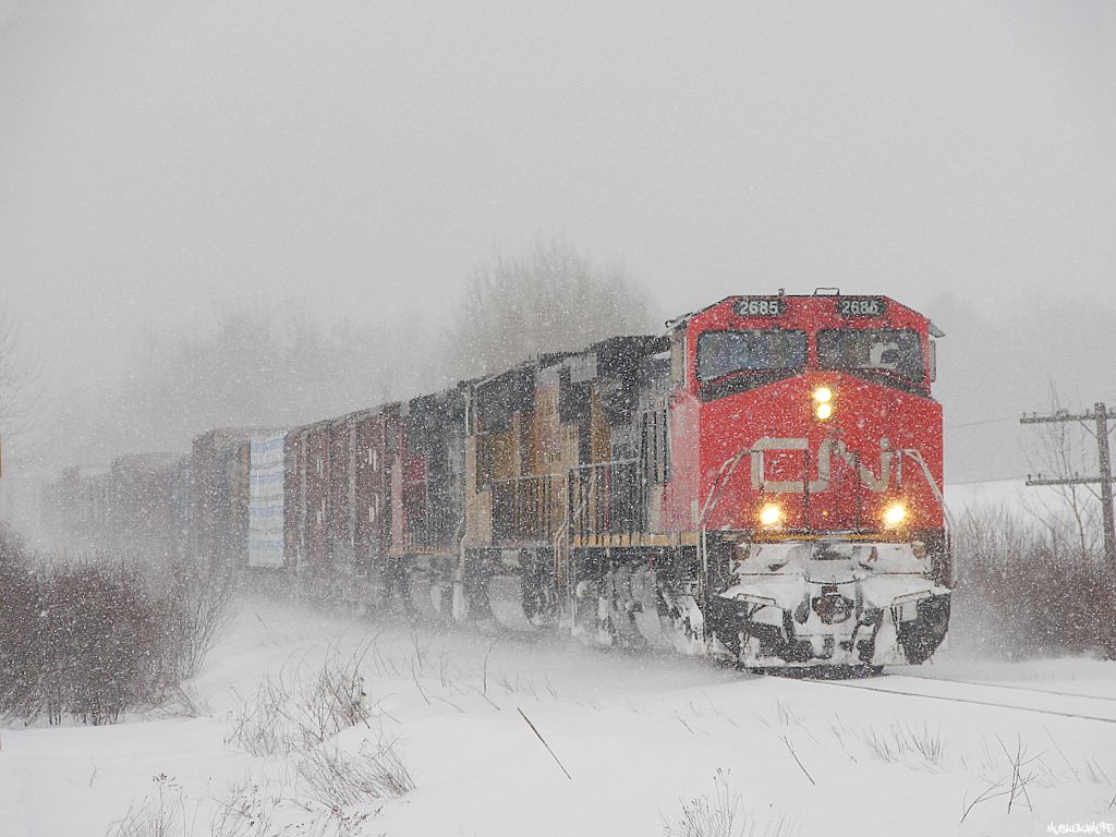 CN 450, CN 2685 South approaching Washago during a usual central Ontario snow-squall in the winter of 2007, back in the days when this assignment ran in daylight hours, often with foreign power.