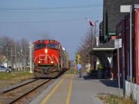 CN 439 led by CN 2691, rolls westbound thru Chatham and passes by the VIA station.