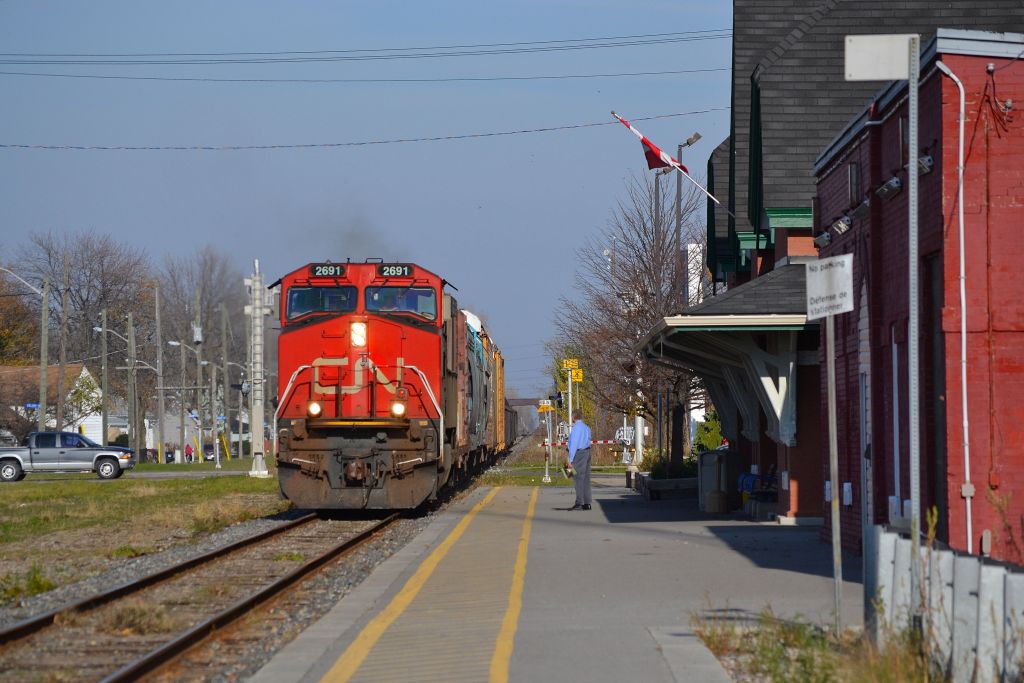 CN 439 led by CN 2691, rolls westbound thru Chatham and passes by the VIA station.