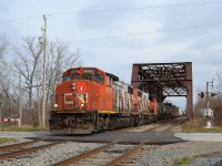 CN 439 sporting a pair of GP38-2W's, speeds westbound thru the steel bridge just outside of Thamesville on its way back to Windsor after making its daily trip to London.