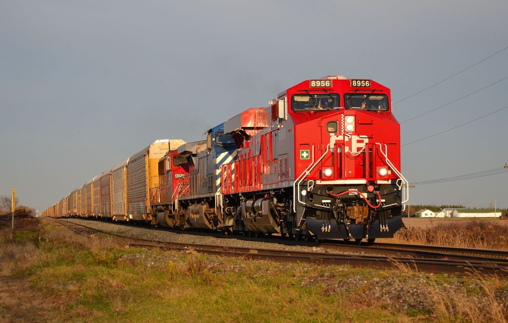 CP 147 led by new CP 8926, CEFX 1014 & SOO 6059 hooked elephant style, heads westbound towards Windsor with this autorack train as it passes the Jeannette setoff siding at mp 76.