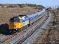 VIA 57 led by 6427 rounds the bend just before it passes under the Lovekin wooden bridge.