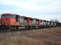 CN 509 led by a pair of SD75i, hauls 4 brand new NS SD70ACes from EMD in London towards Sarnia where they will be put on another train destined for the US.