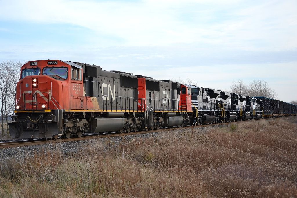 CN 509 led by a pair of SD75i, hauls 4 brand new NS SD70ACes from EMD in London towards Sarnia where they will be put on another train destined for the US.