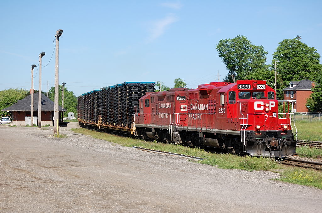 Working past the Galt station, old CP 142 (the Frame Train) slides through the curves with vehicle frames from the Magna plant in St Thomas for the GM plant in Oshawa.