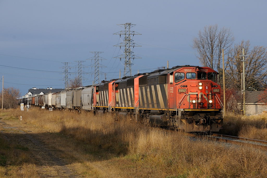 Racing the first snowfall of the year, CN A436 with a trio of SD60F\'s catches a glimse of sun as the crew cross town with their headend 69 cars bound for Port Arthur. Upon arrival in PA, they would yard the train on TC92 (the usual outbound track) due to no room in the yard. Earlier in the morning (under the cover of darkness), grain train G840 yarded, his power was another set of SD60F\'s!