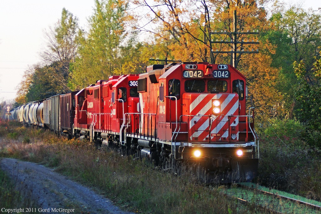 In the early morning hours T08 passes by the one time location of Locust Hill Station in Markham Ontario.Its hard to believe that this was once the busiest station stop on the original Ontario&Quebec Line.The Station resides in the Markham museum to this day.
