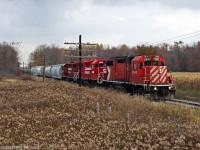 The current Havelock consist in red different reds blends with the browns and oranges of mid fall.Todays payload of 26 cars is headed to the Toronto Yard a 45min snail pace away,and then a return to Havelock as T08 with a load of mostly empties.A very long day by any standard.