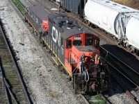 A switch crew at Sarnia gets a momentary break from walking as they ride their engine while making a runaround move from the west end to the east end of the "C" yard. The large yard at Sarnia keeps multiple switch crews busy around the clock, and today is no exception.